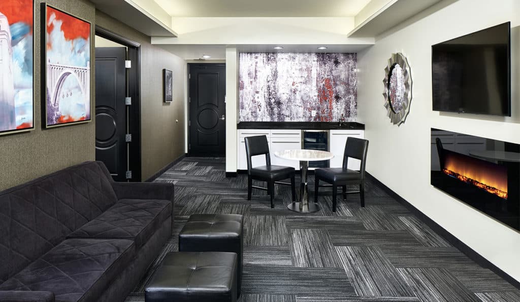 Davenport Grand | Penthouse Suite living area | Fireplace, table and chairs
