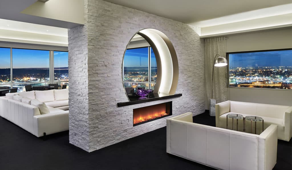 Presidential Suite nook Couches and fireplace| Davenport Grand