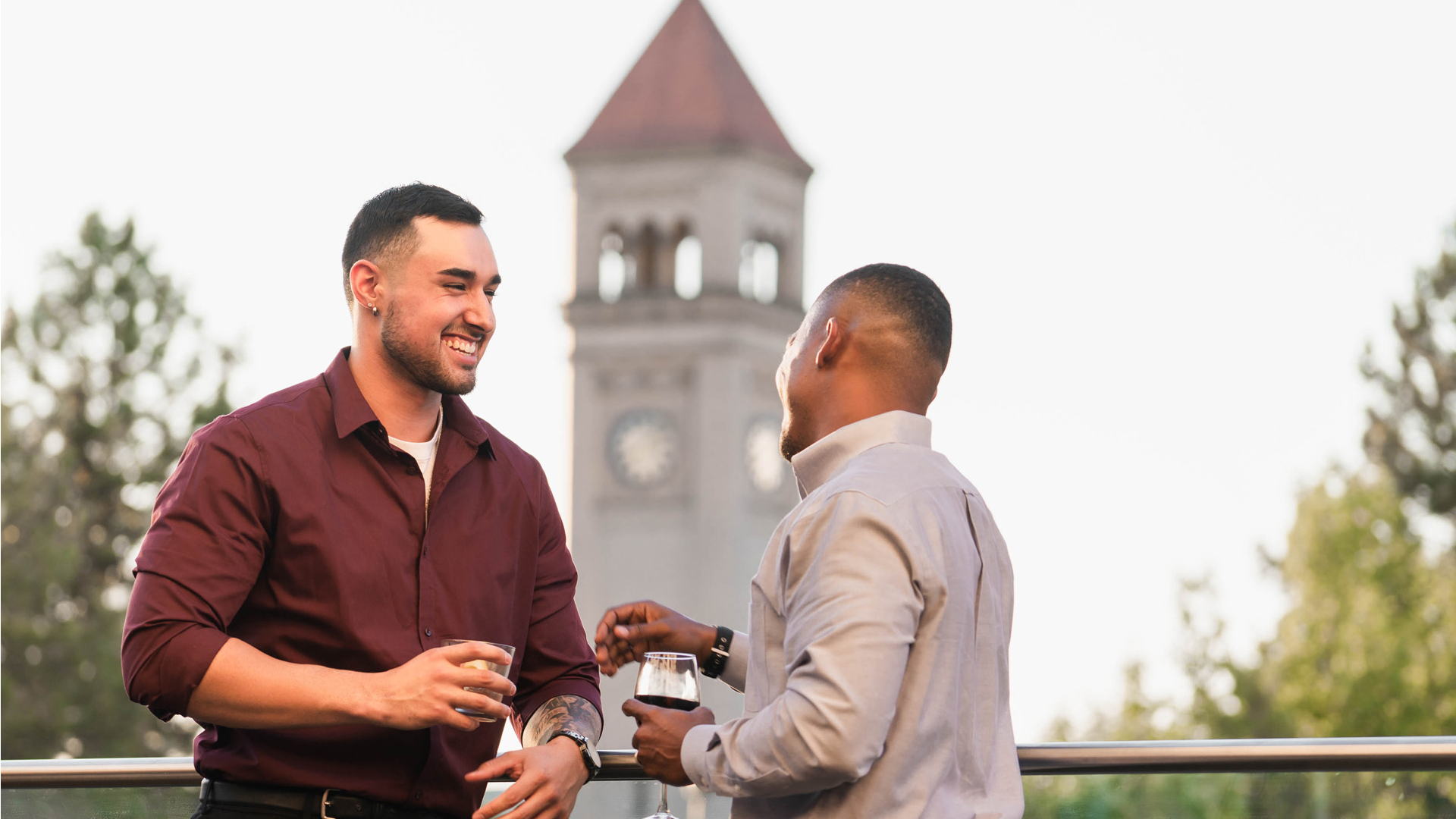 men talking on the rooftop terrace