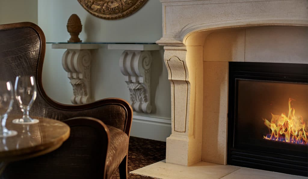 Davenport Lusso Suite Fireplace and chair