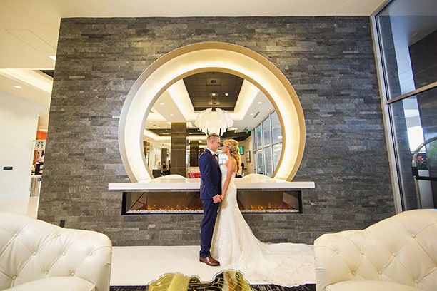 Bride and Groom Kiss in Lobby