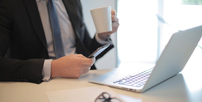 Davenport Lusso | Business center | Guy with computer phone and coffee