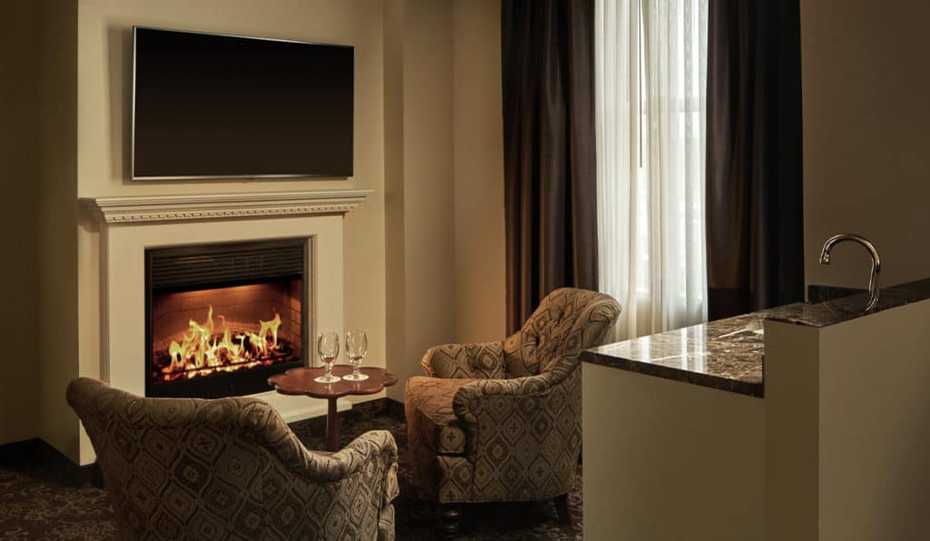 Honeymoon Suite living space - Fireplace | Historic Davenport