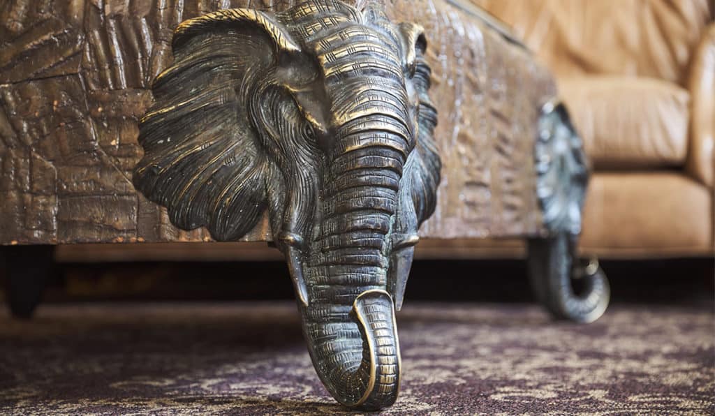 Table with elephant face legs | Apartments Room | Historic Davenport